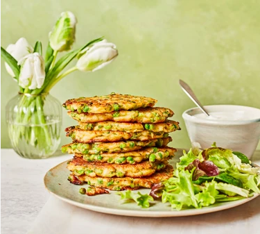 Pea And Halloumi Fritters With Charred Lemon Drip